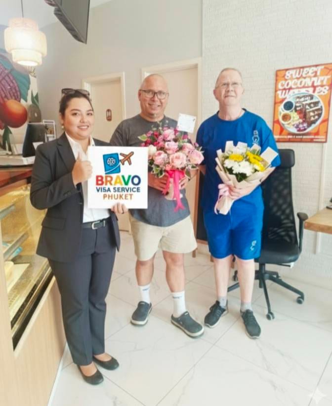 Happy clients receiving flowers at Bravo Visa Service